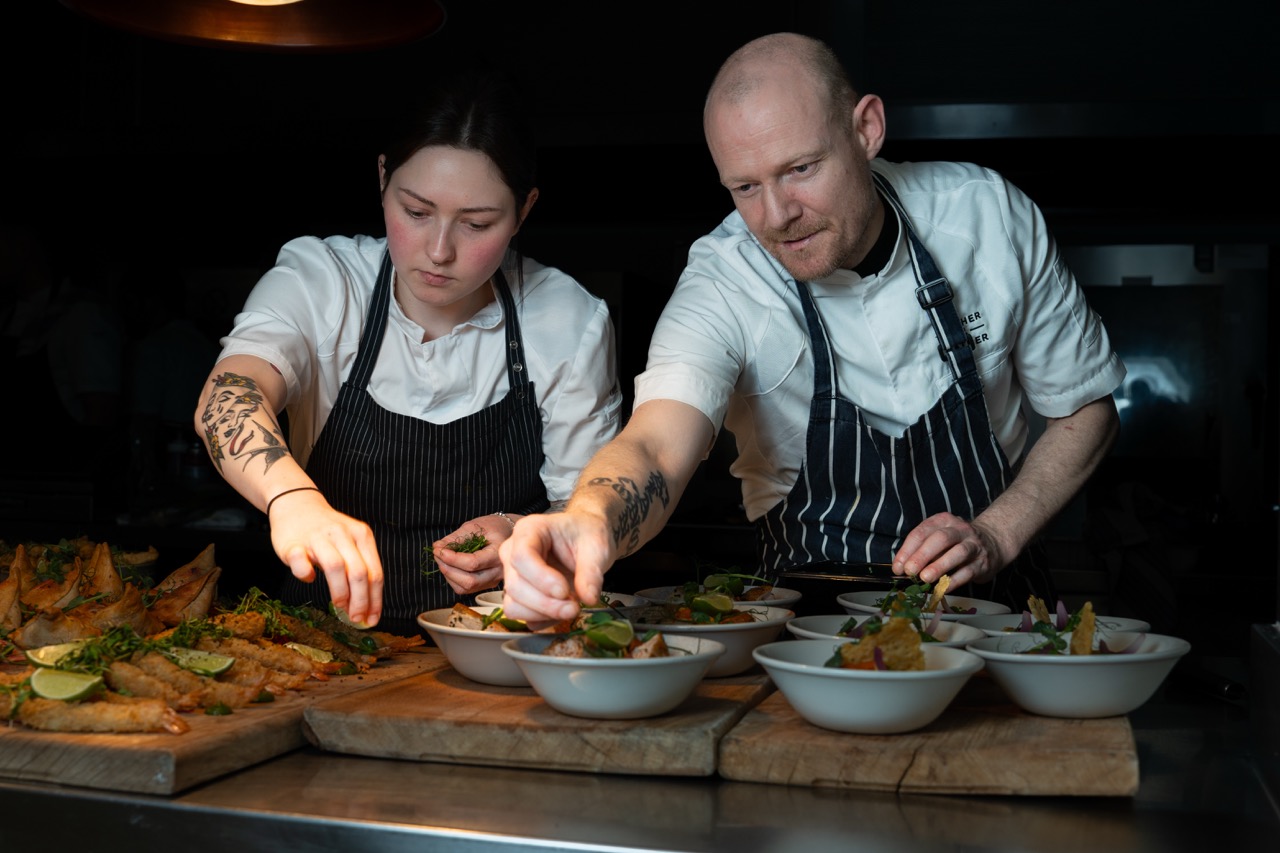 Two chefs preparing food at Gather + Gather Ireland