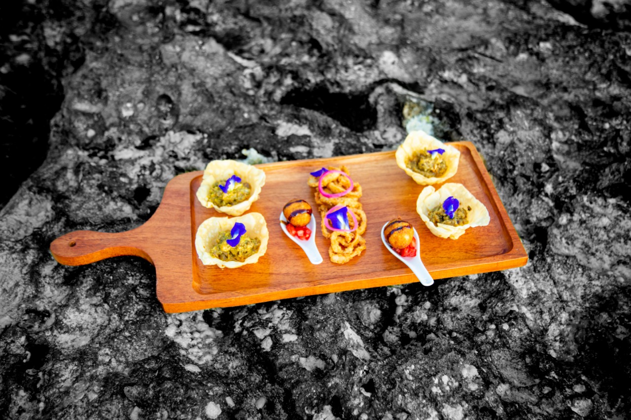 A wooden tray of beautiful food at Fahari Off The Grid
