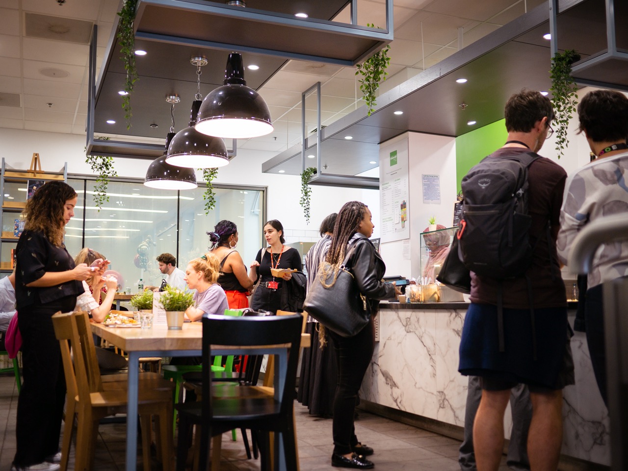 Customers ordering food in London School of Economics restaurant