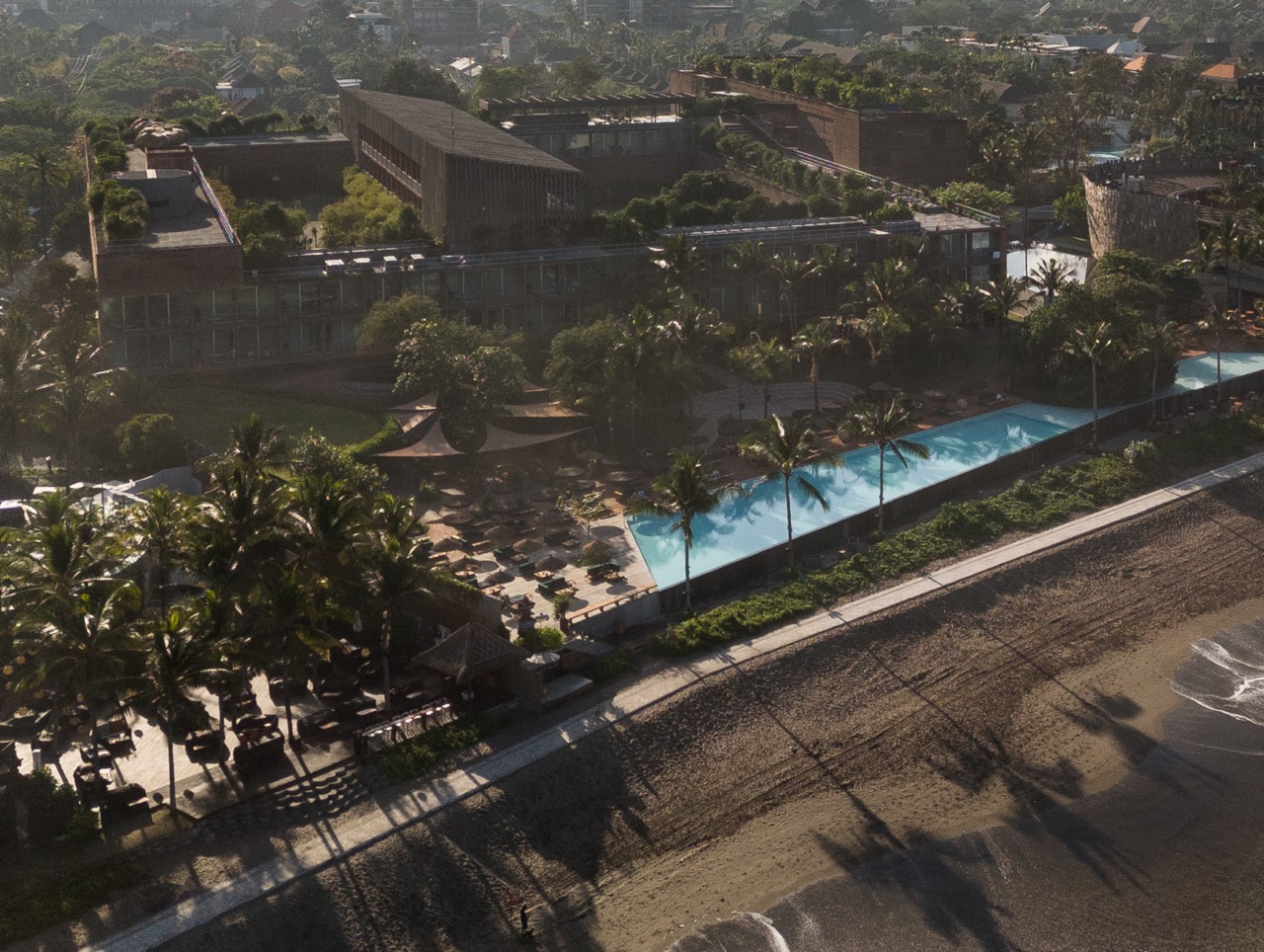 Overhead shot of Potato Head, Bali, showing buildings and pool beside the beach