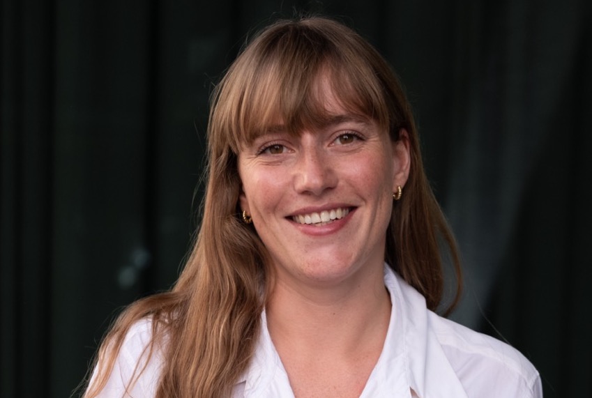 Headshot of Holly Letch, Sustainability Manager at JKS, landscape against a dark background