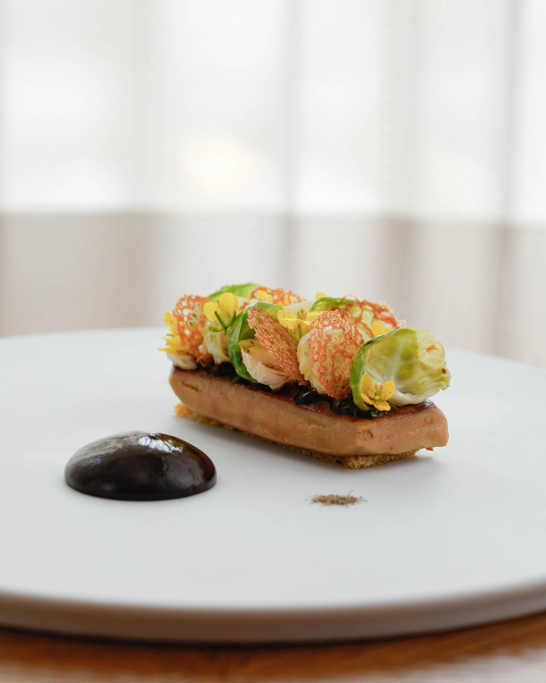 Beautifully presented food on white plate