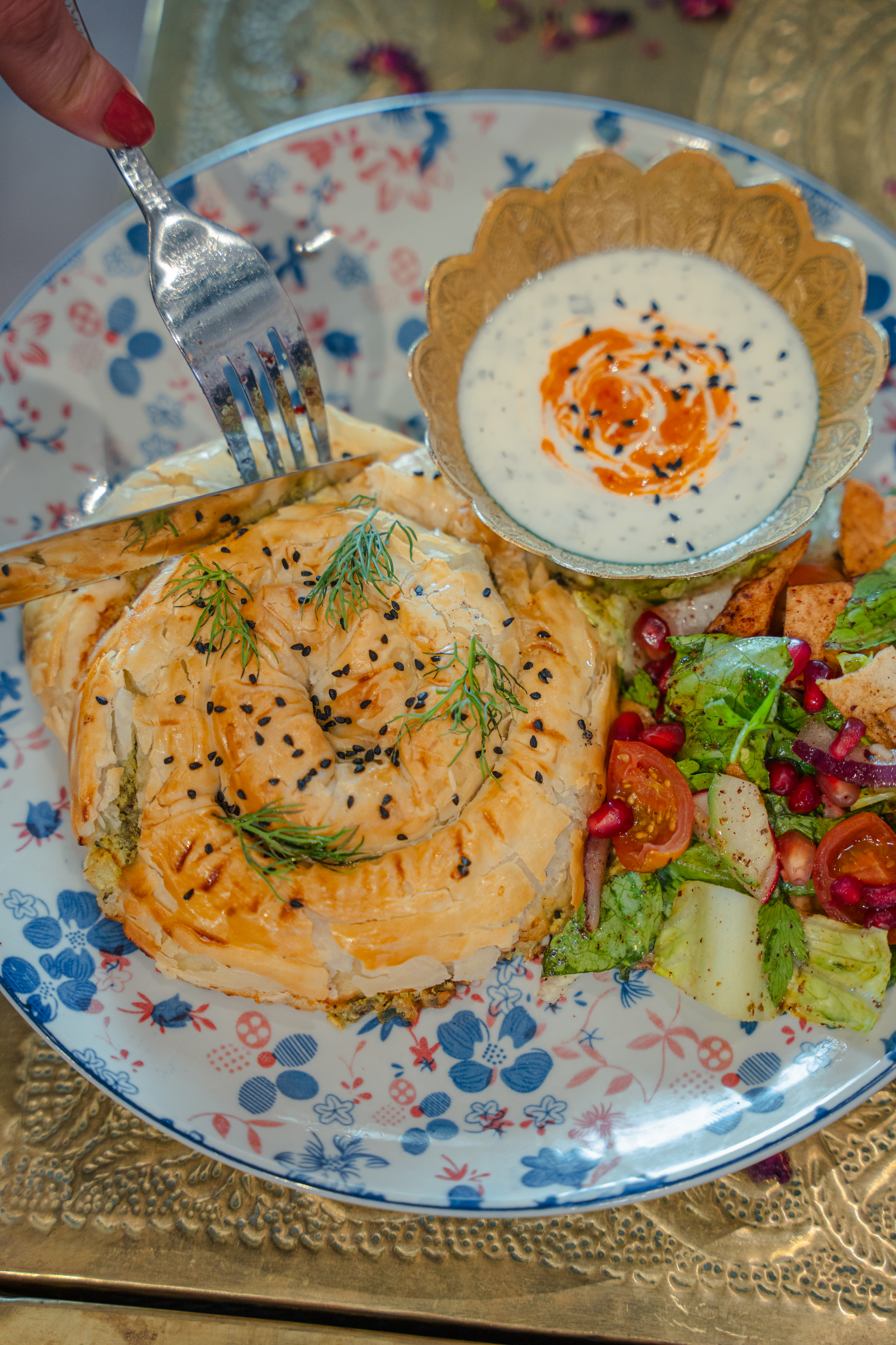 Pastry dish with yoghurt sauce at Comptoir Libanais