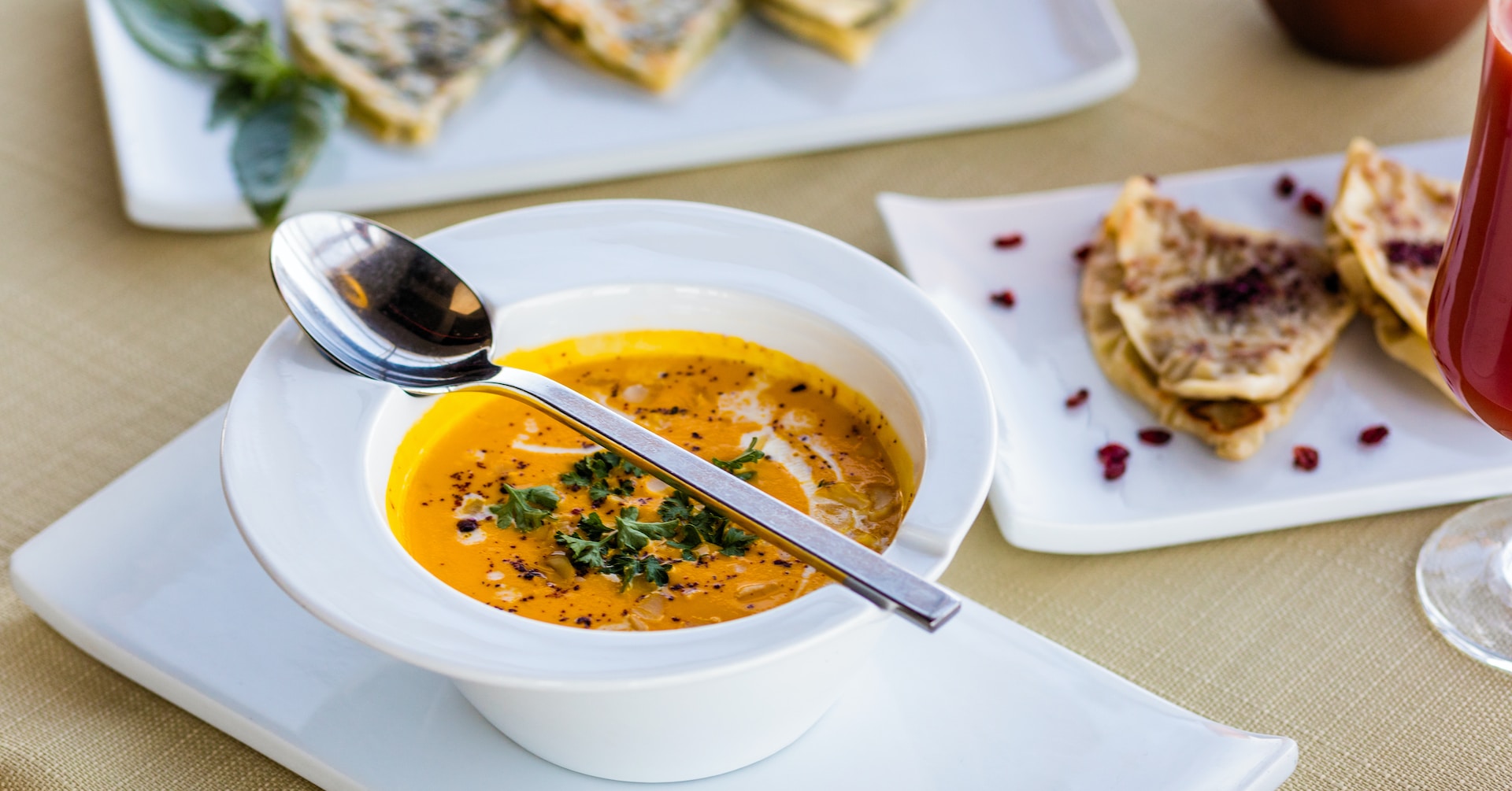 Vibrant orange soup with flatbreads