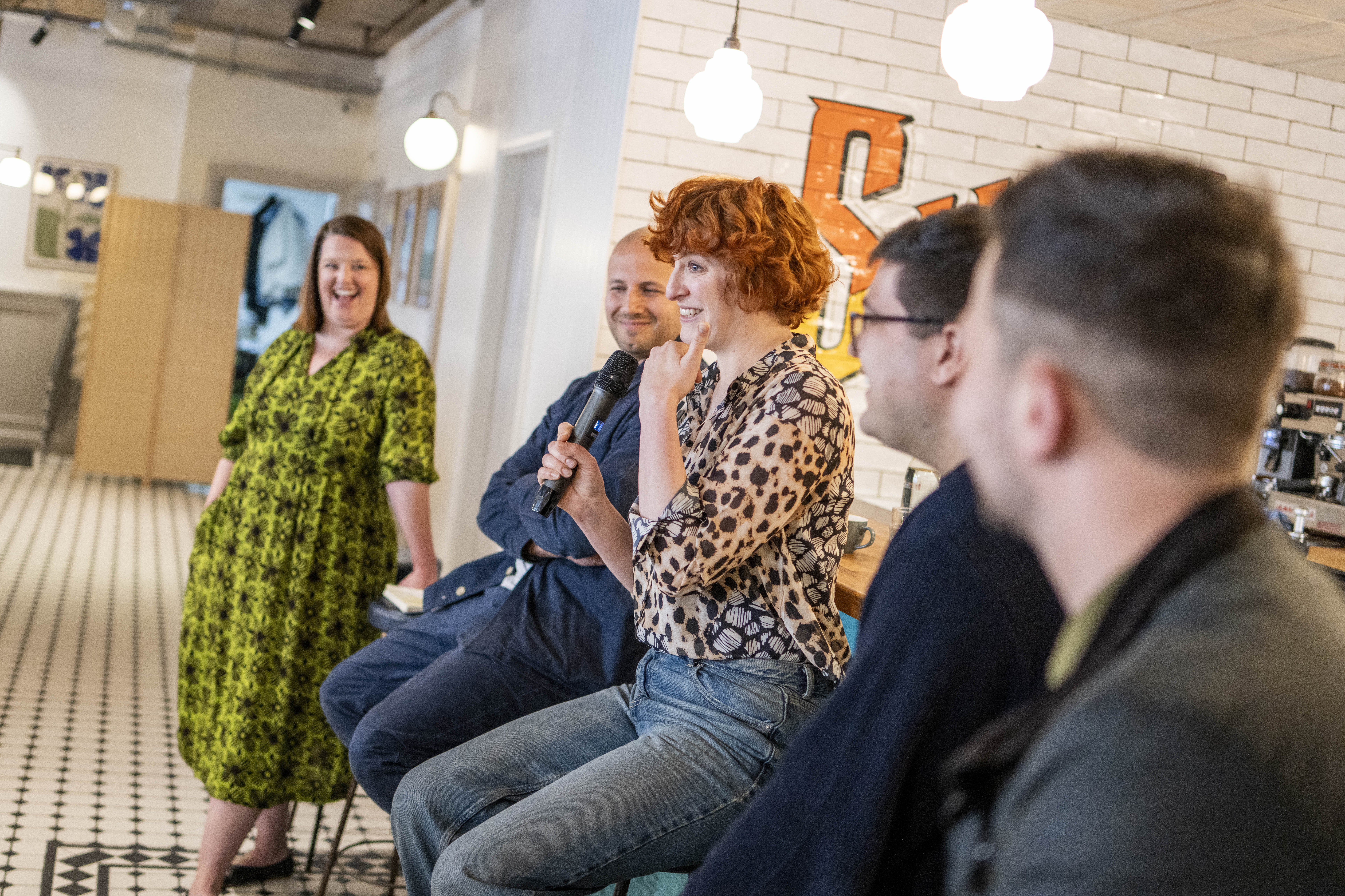Juliane Caillouette Noble hosting panel at event