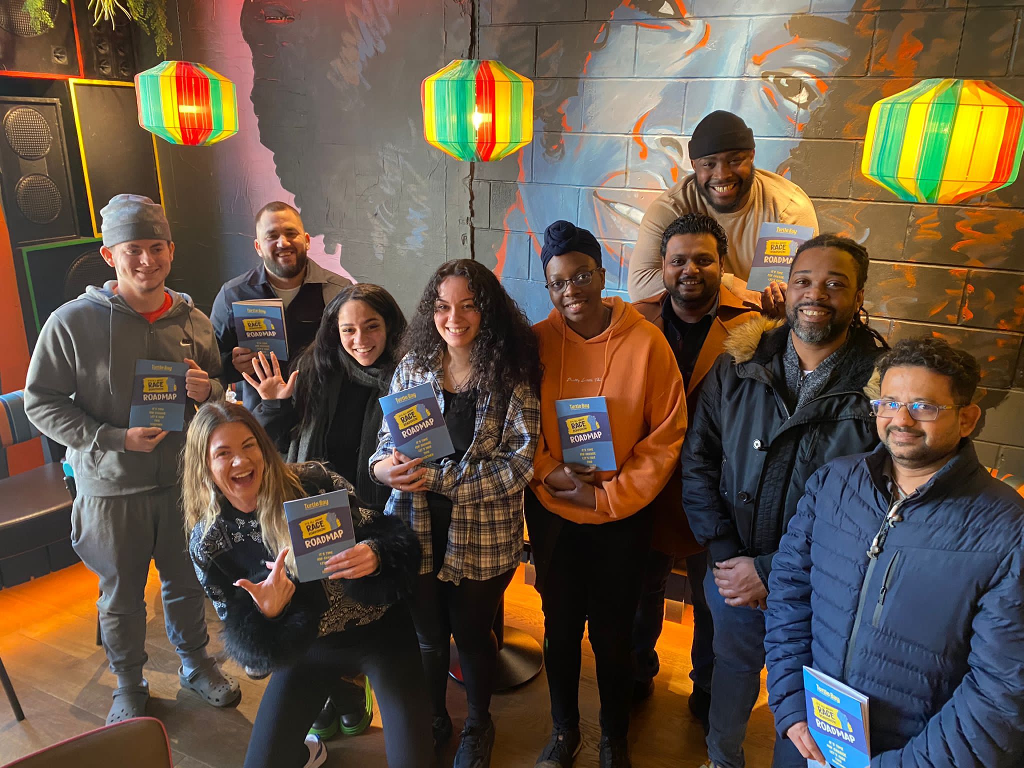Group of people in blue at Turtle Bay It's All About Race Roadshow