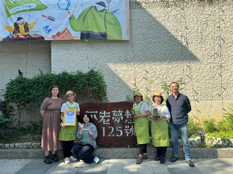 A group of hospitality employees holding a Food Made Good certificate