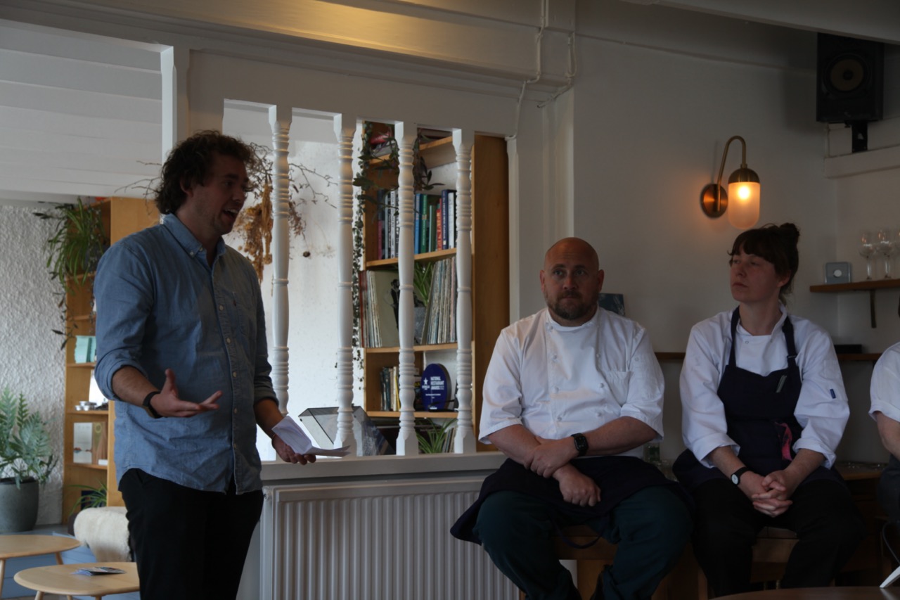 Will Browning moderating a panel with Chefs James Ferguson and Rosie Healey in shot