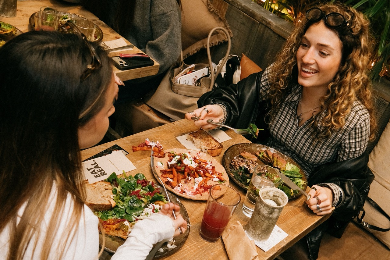 Two customers sharing a meal at Honest Greens