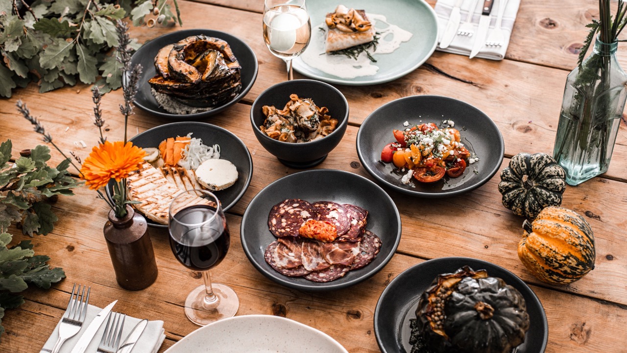 Selection of dishes on wooden table at Pythouse Kitchen Garden 