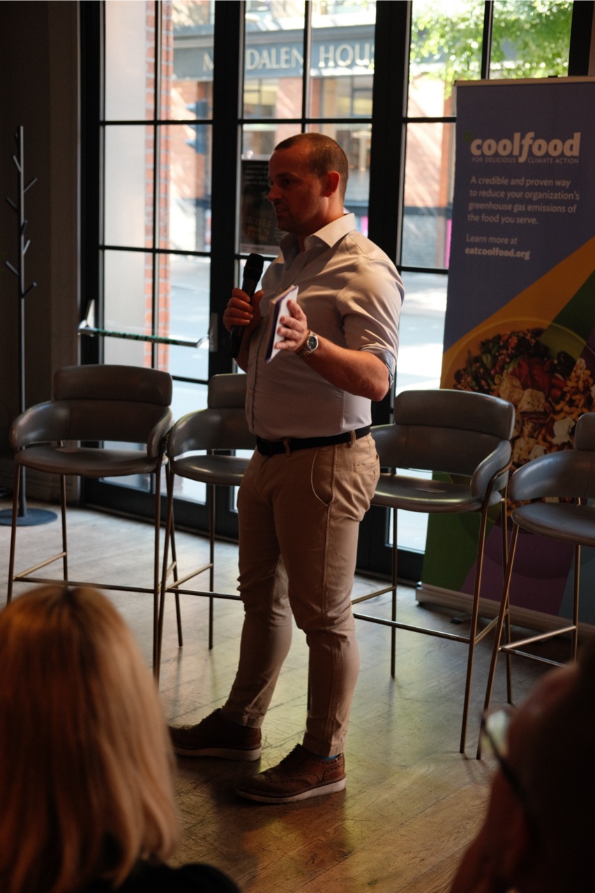 Greg Bramwell from BaxterStorey speaking into a microphone at the Rethinking the Menu event