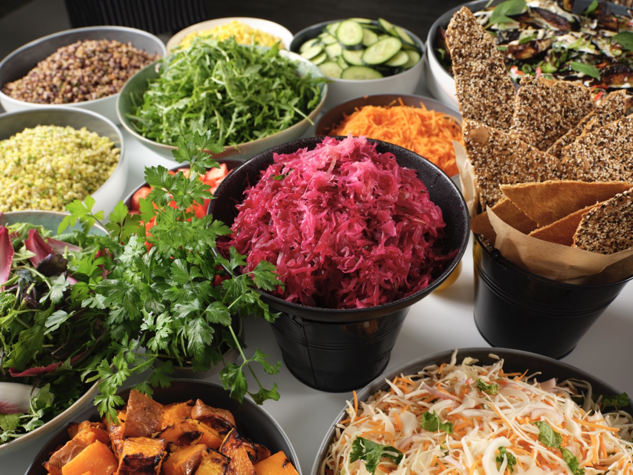 Colourful salad bar with bowls of fresh vegetables at Restaurant Associates