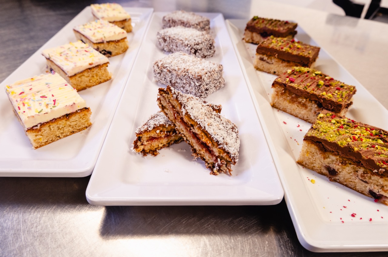 Plant-based cakes on display on white plates at King's College London