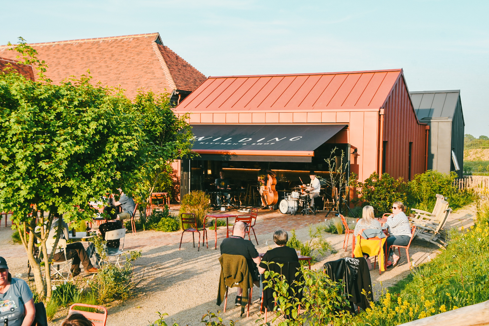 Customers sitting outdoors at Knepp Wilding Kitchen