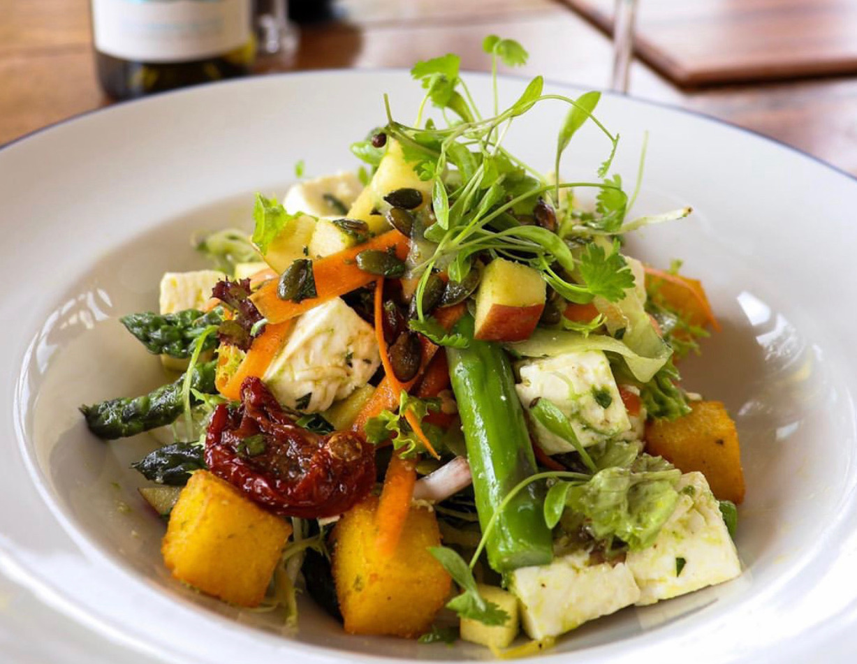 Bowl of vegetables and cheese cubes at Brunning & Price