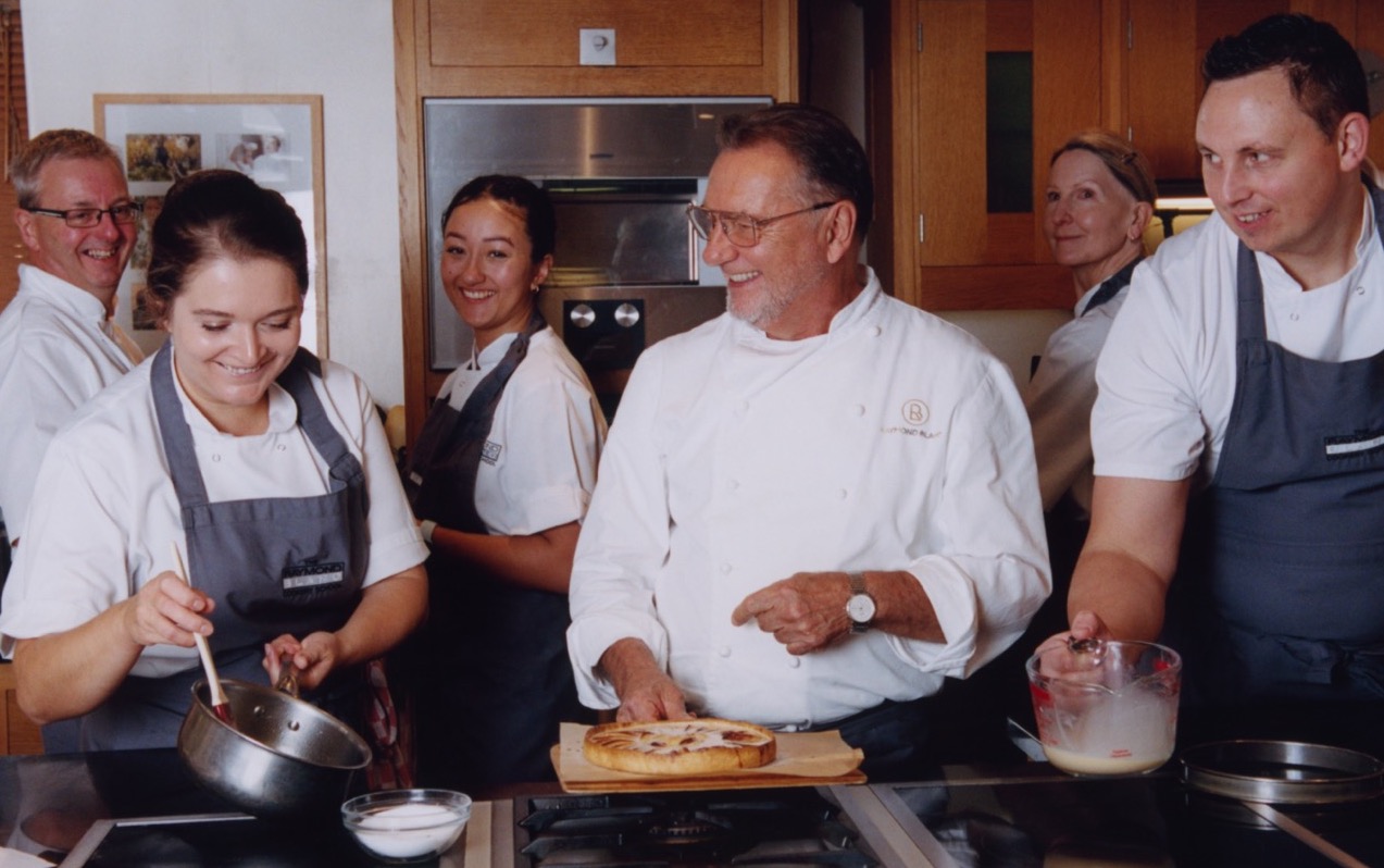 Raymond Blanc with students at the Raymond Blanc Cookery School