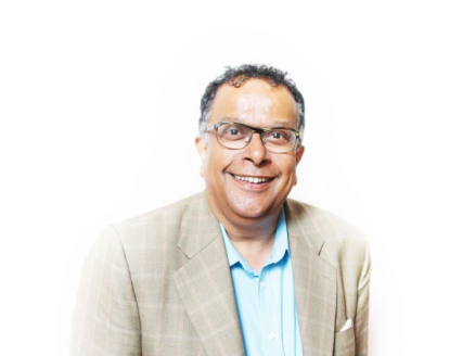 A headshot of Iqbal Wahhab against a white background