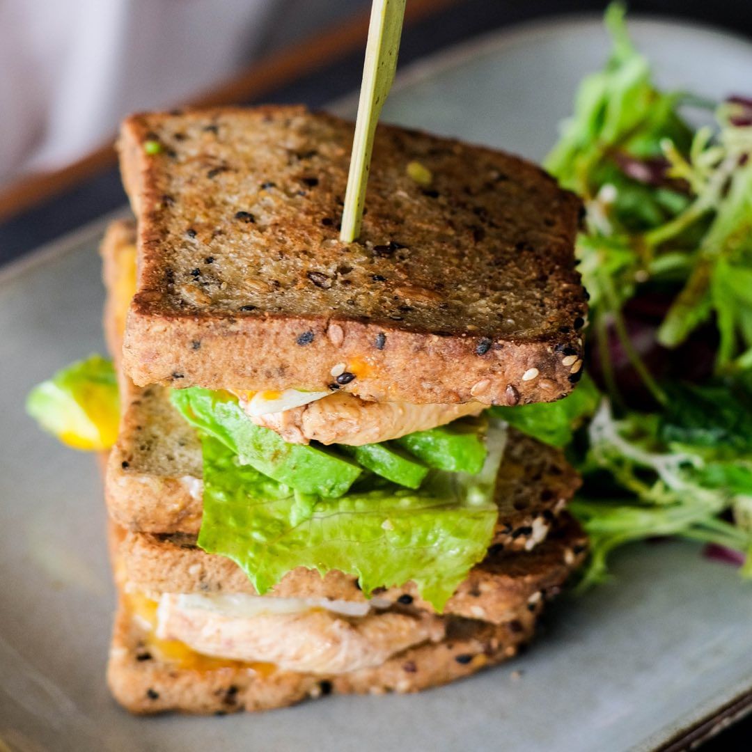 Close up of toasted sandwich on seeded bread