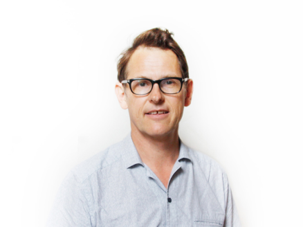 A headshot of Mark Sainsbury against a white background