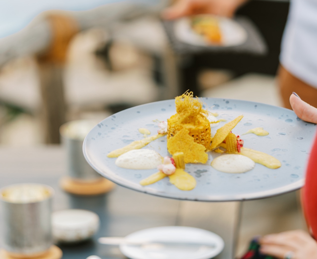 A plate of food being served outdoors at Six Senses Zighy Bay