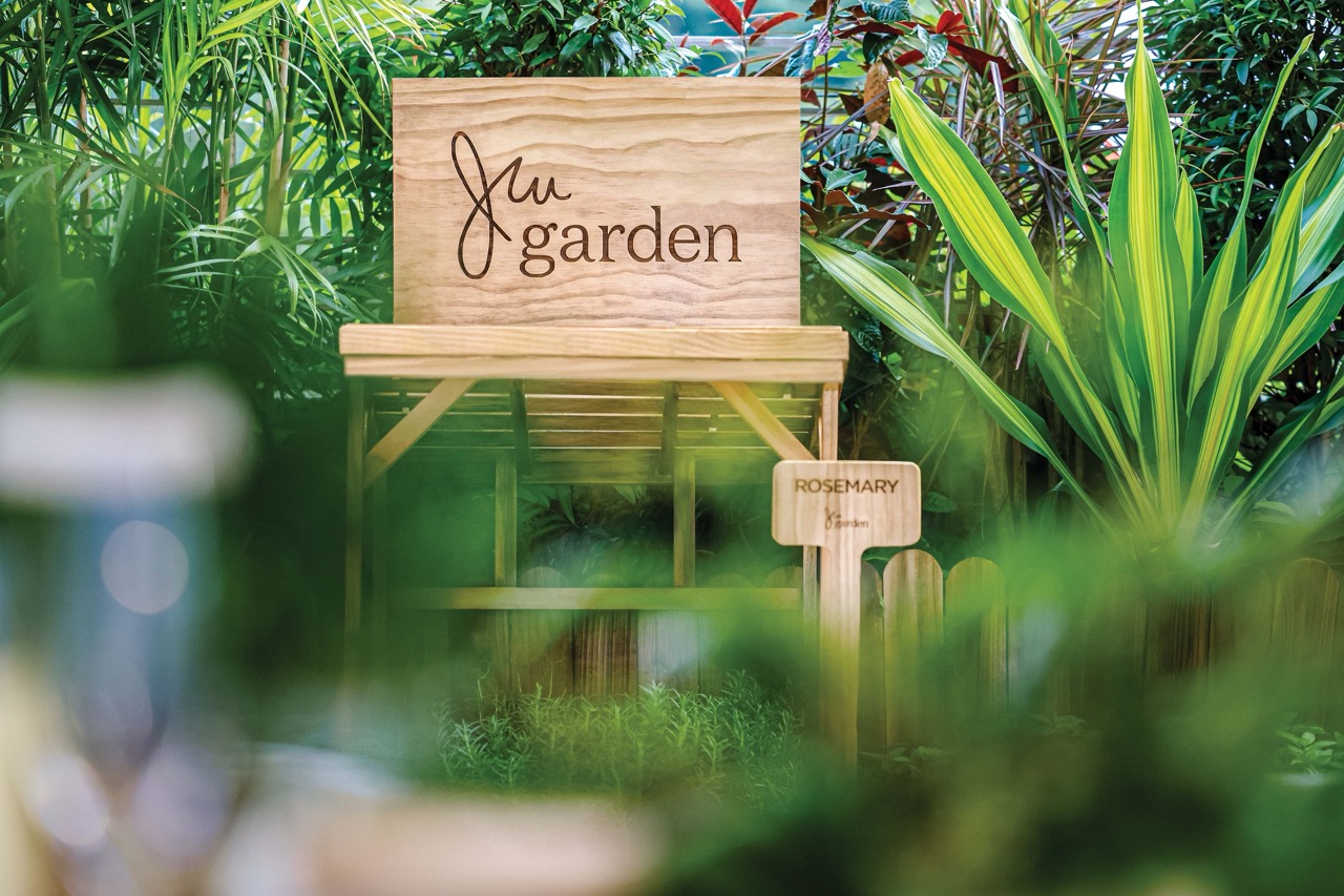 A wooden sign for the JW Garden at JW Marriott Hotel Hong Kong