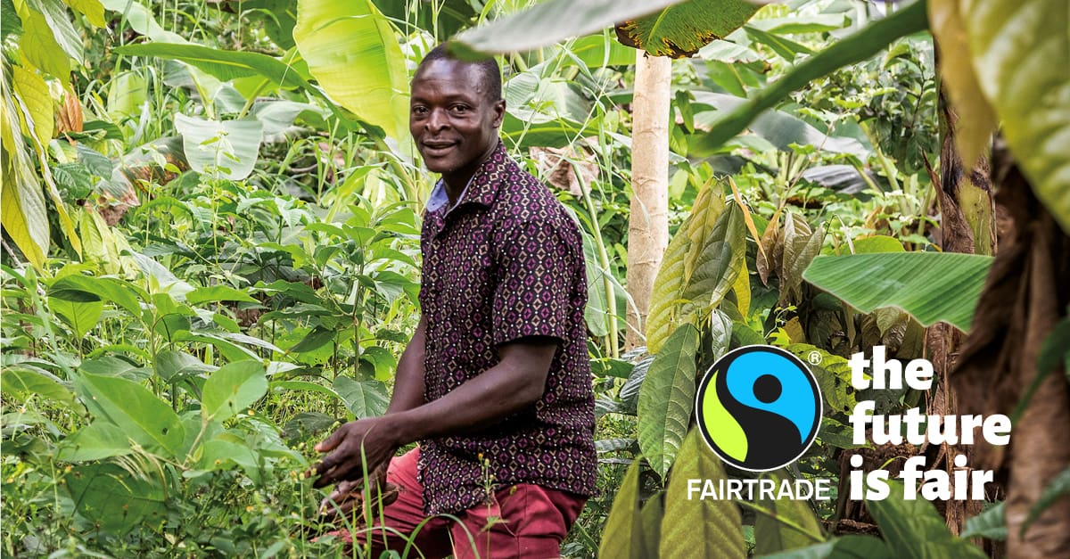 Image of producer against forest background with Fairtrade logo