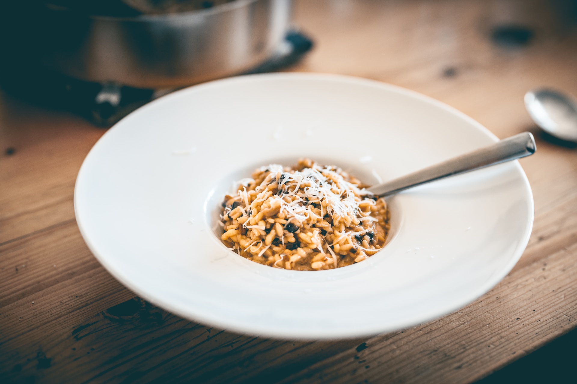 Mushroom risotto in wide-rimmed white bowl
