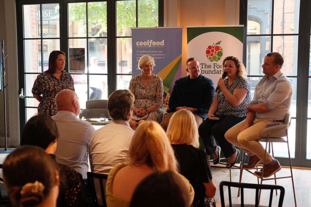 Panel of four people in front of an audience at the Rethinking the Menu event