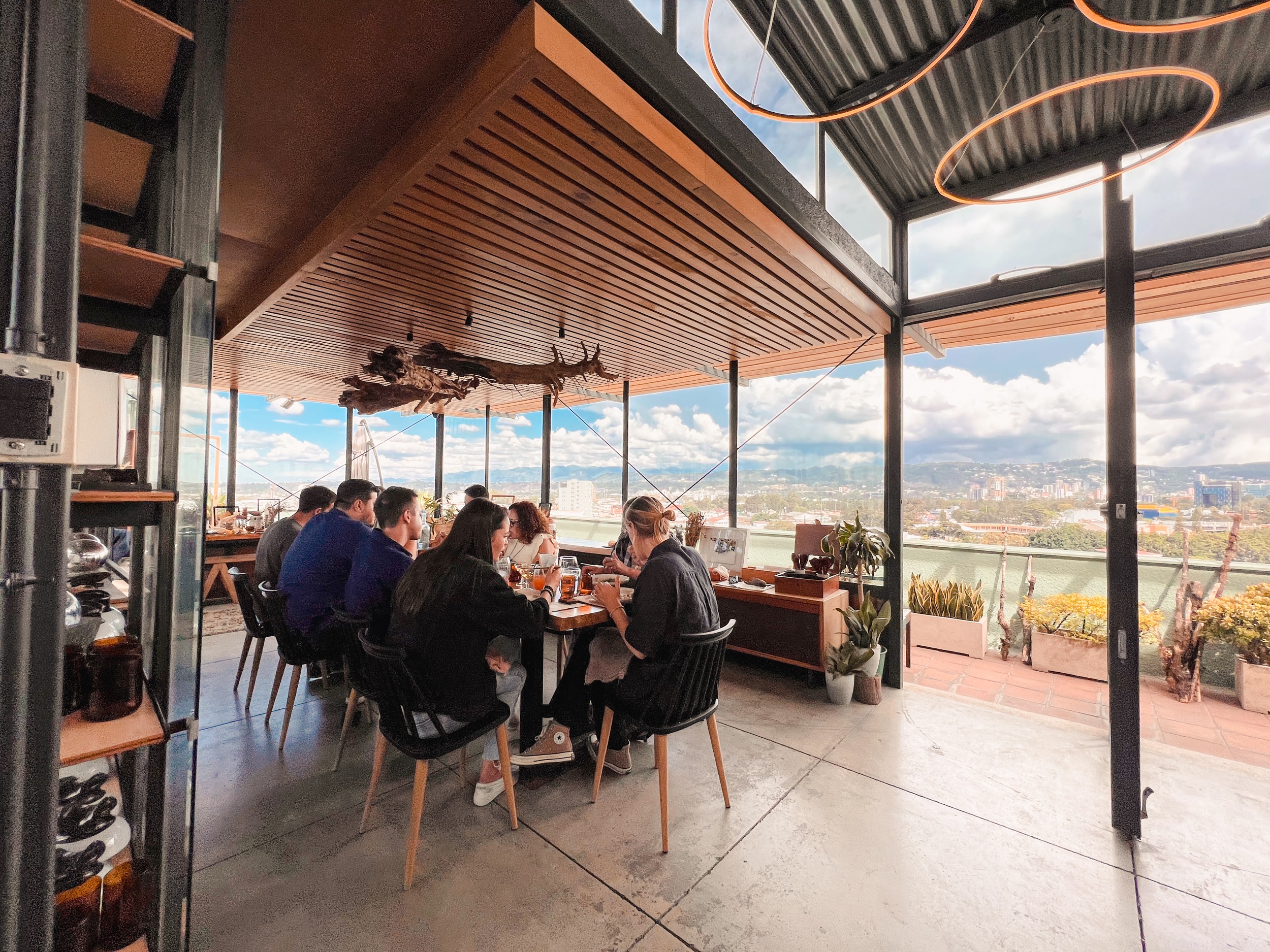 Customer eating at restaurant with spectacular views