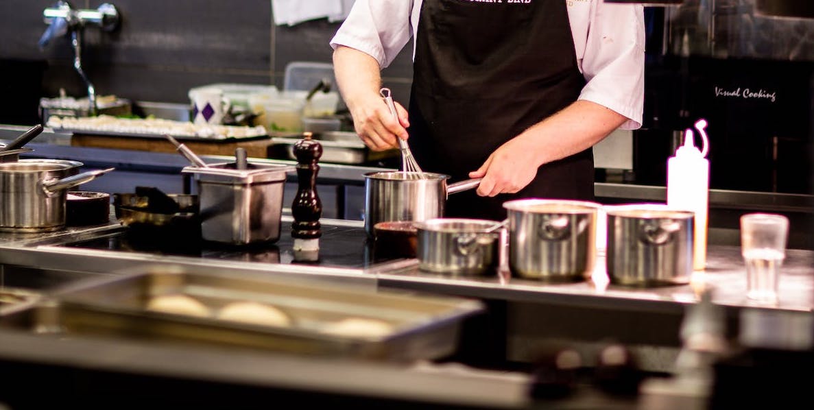 Chef in kitchen preparing food
