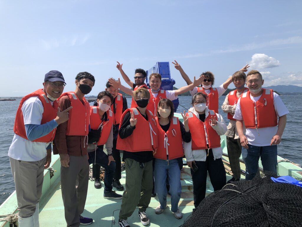 Pizzeria Gtalia Da Filippo employees wearing red lifejackets on a boat