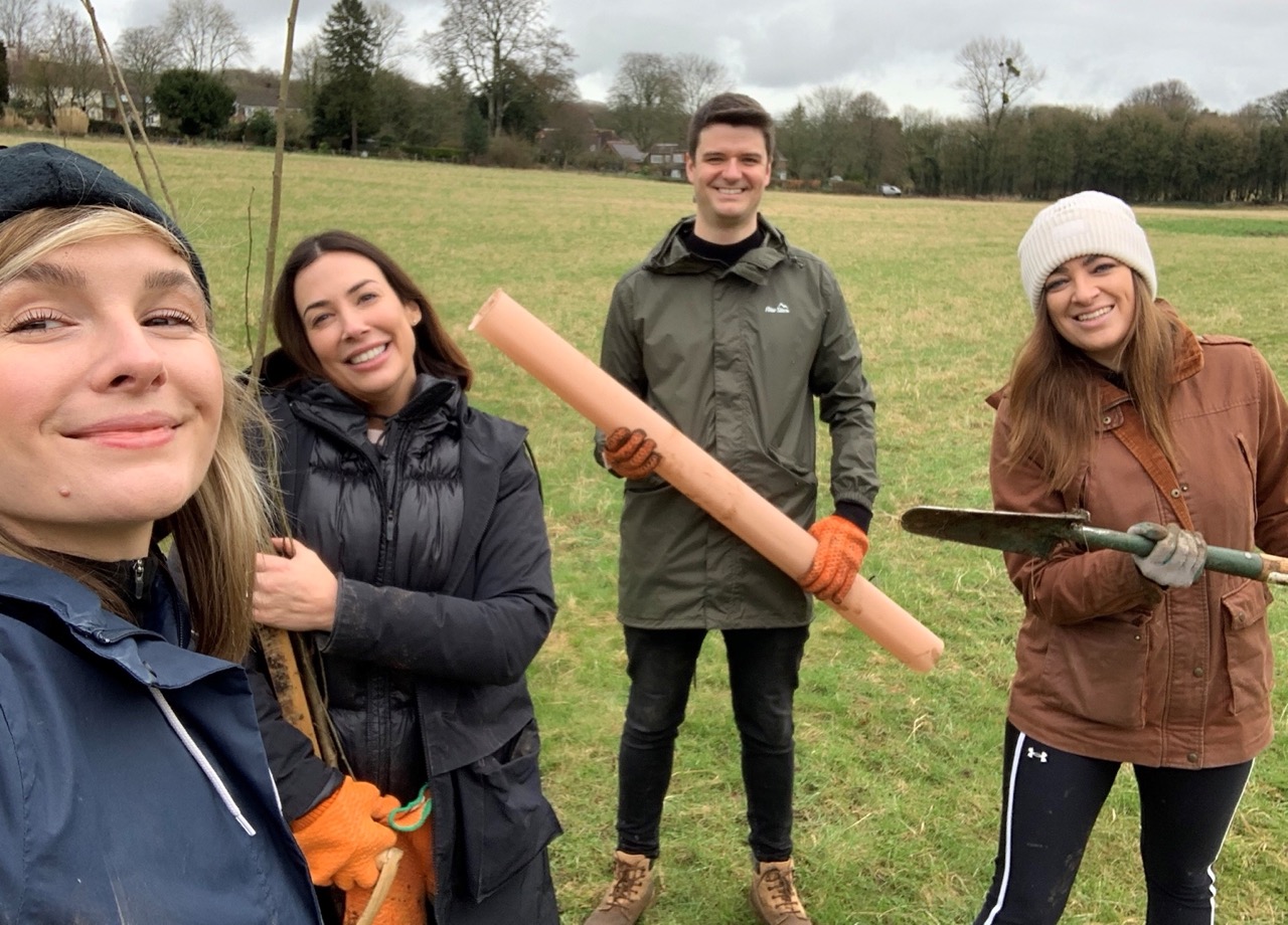 Team of staff from THE PIG Hotels doing volunteer work planting hedges