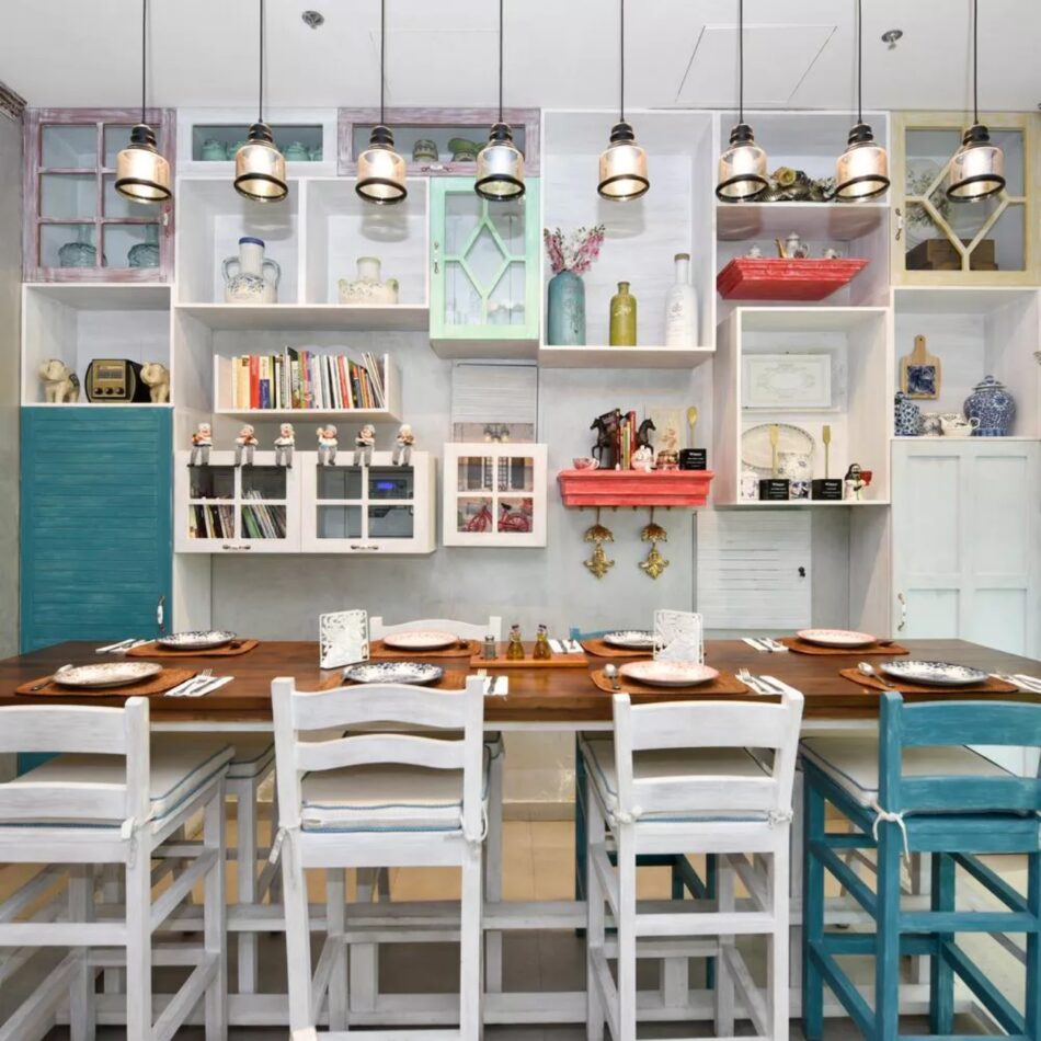 Bright restaurant interior with one big table set for customers