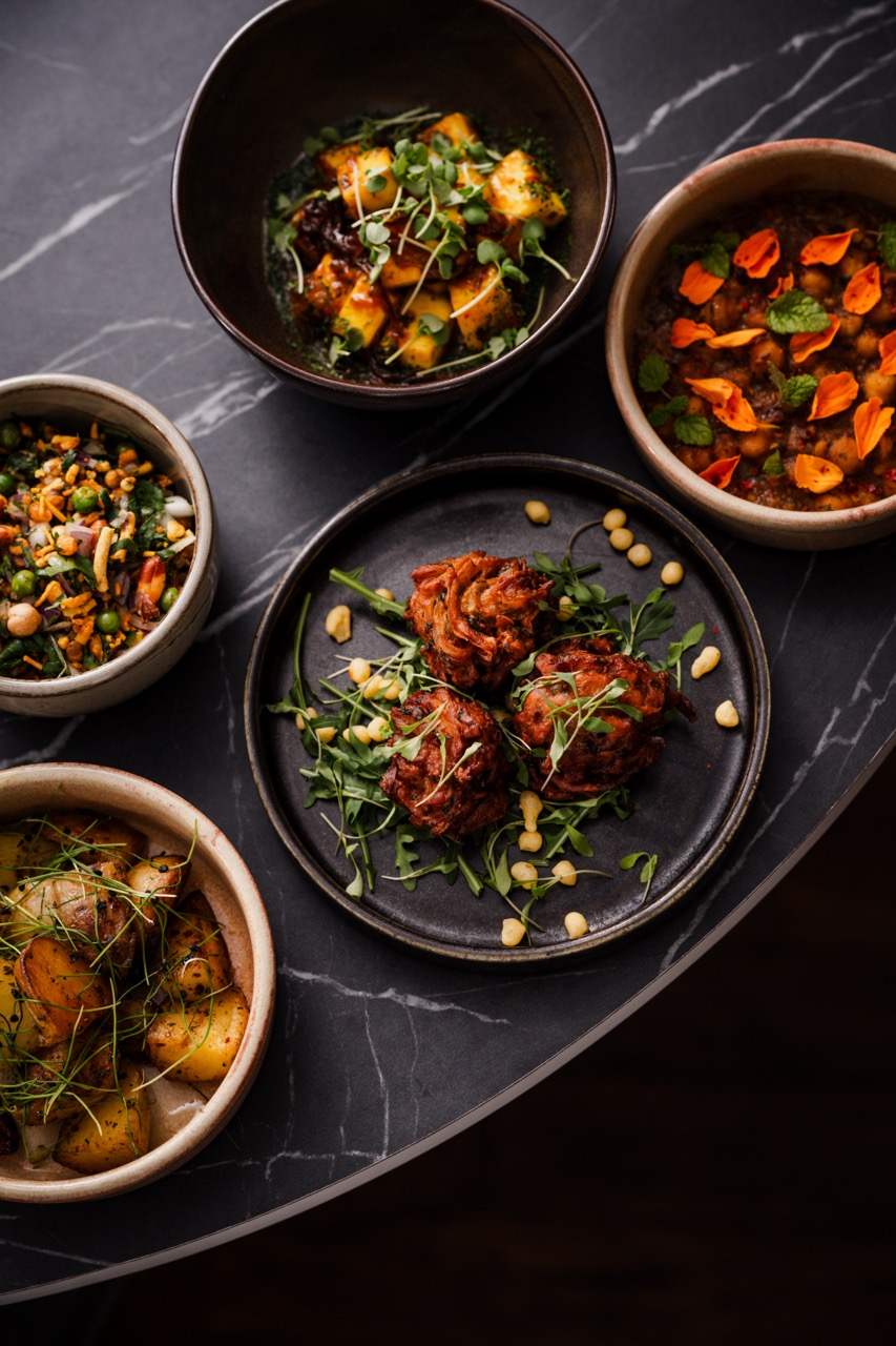 Overhead shot of beautiful food in dark bowls at Lavang