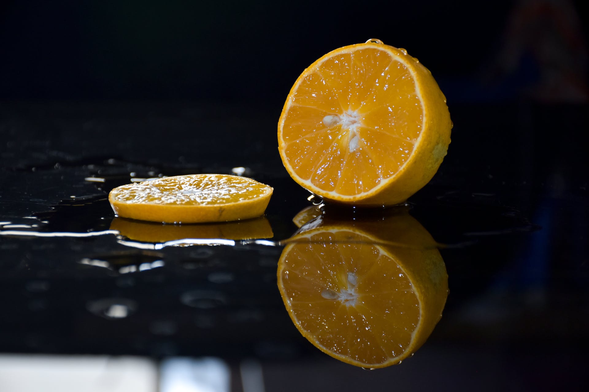 Sliced orange on dark background
