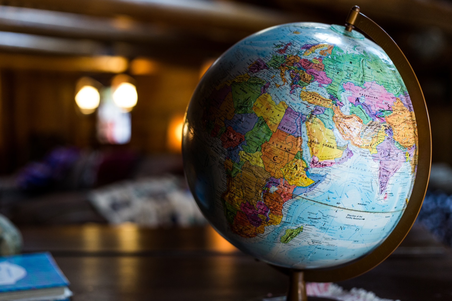 Globe on table in softly lit room