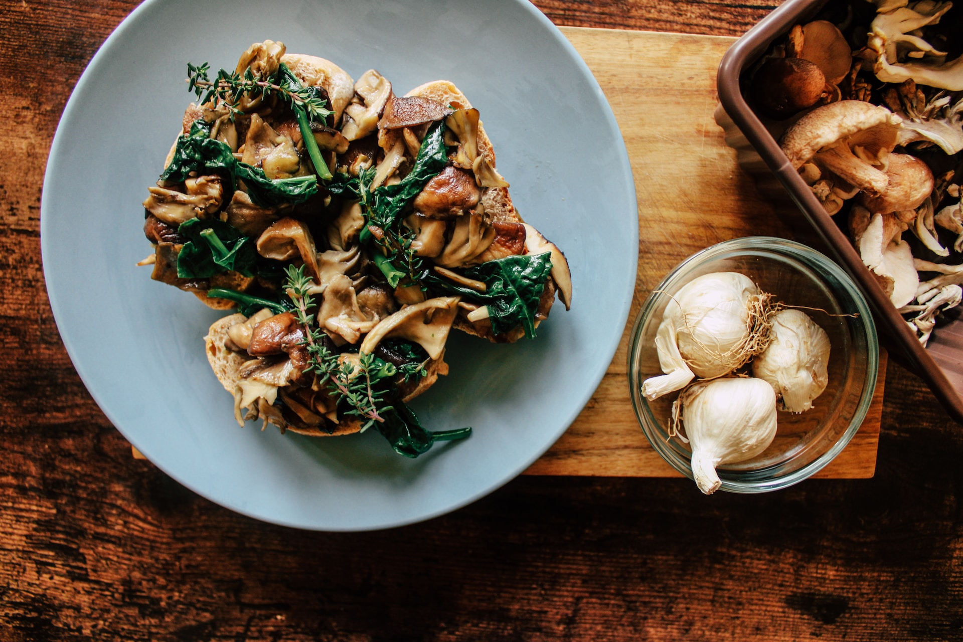 Overhead shot of mixed wild mushrooms on toast