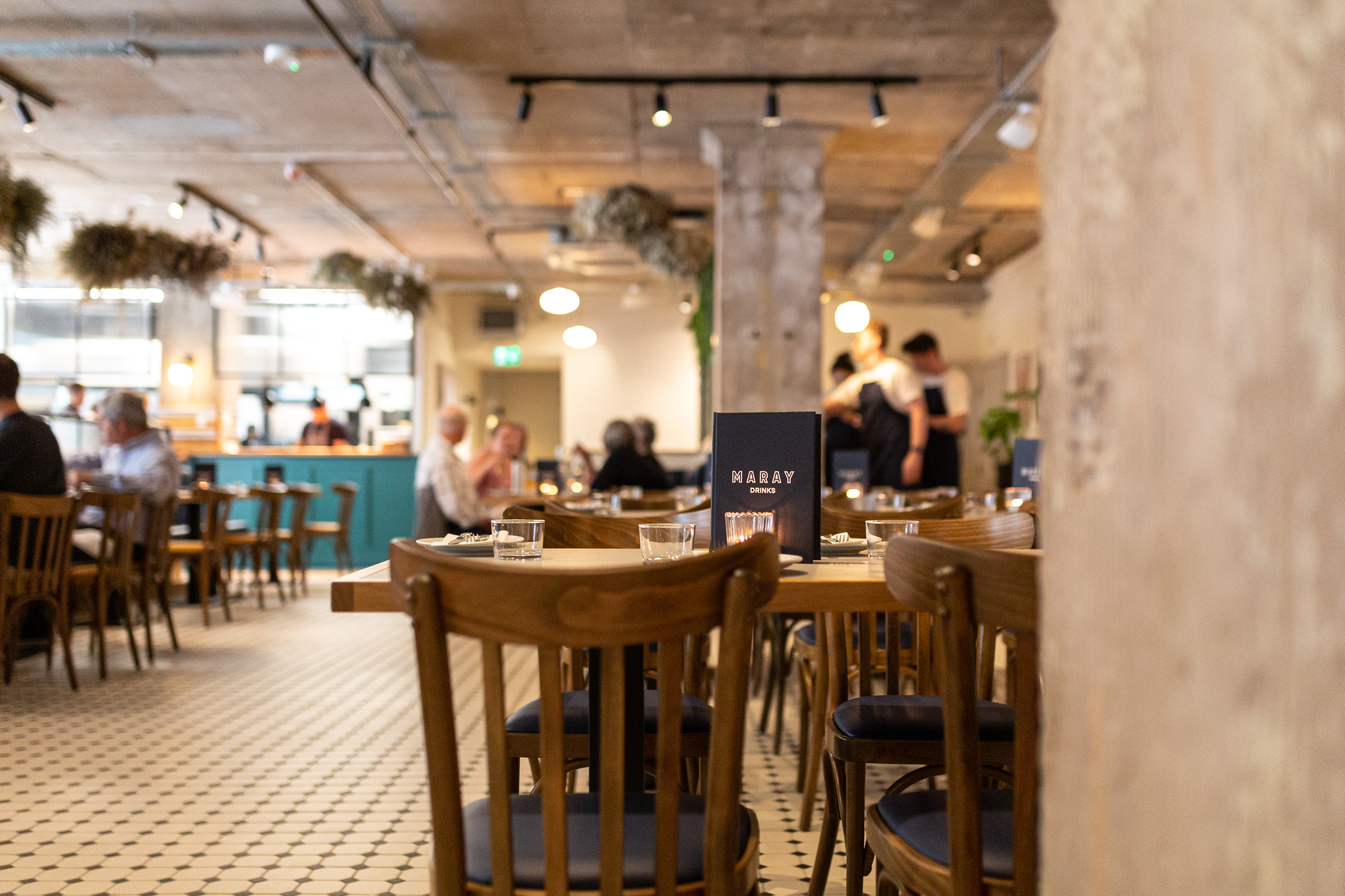 Interior shot of Maray with customers seated in background