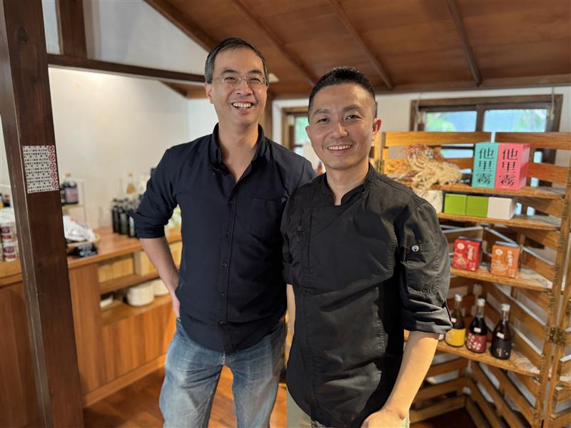 Two men in Taiwan smiling for the camera