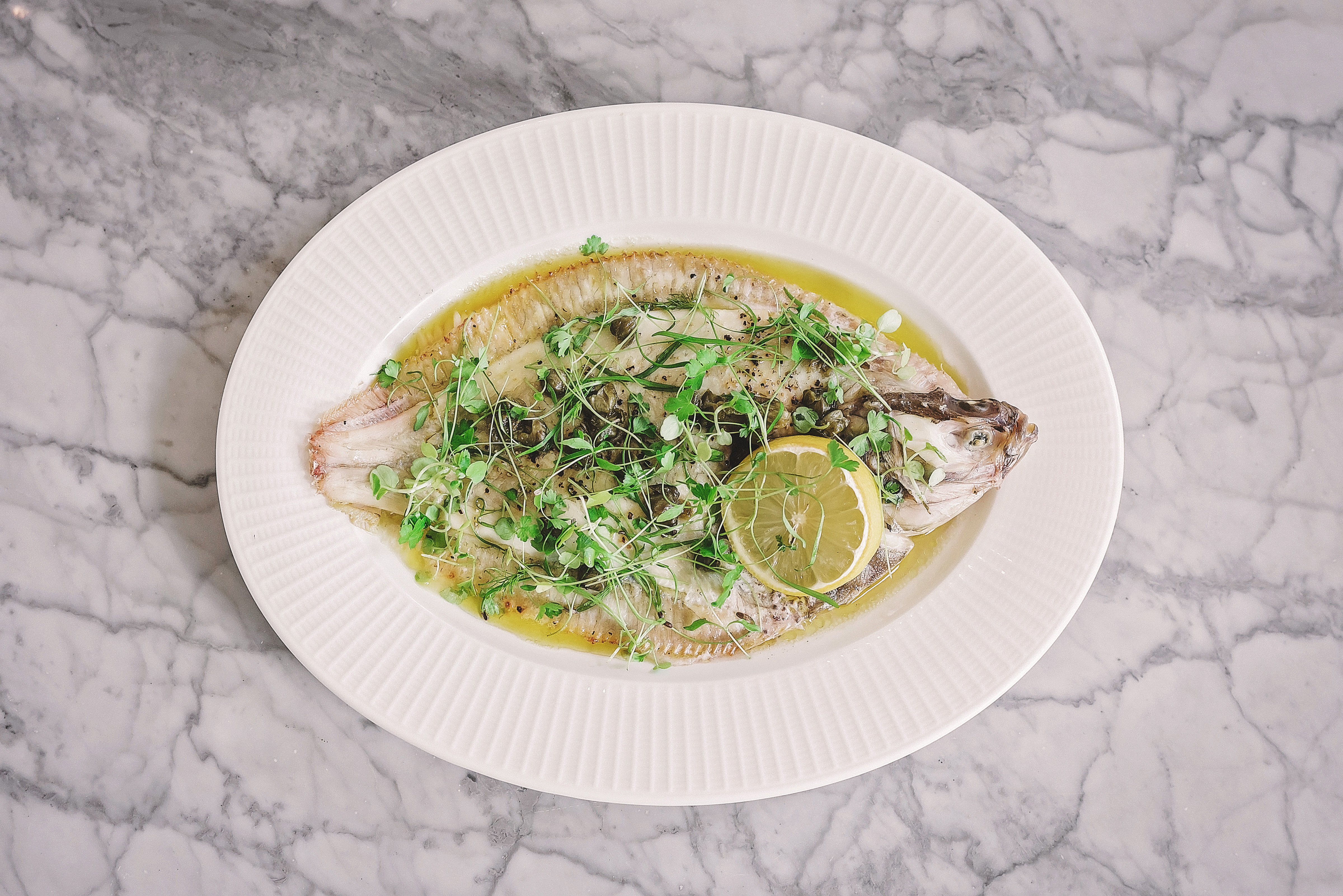 Overhead shot of sole with peas at Lussmanns