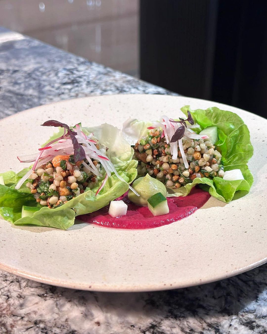 Mixture of vegetables and legumes in lettuce cups