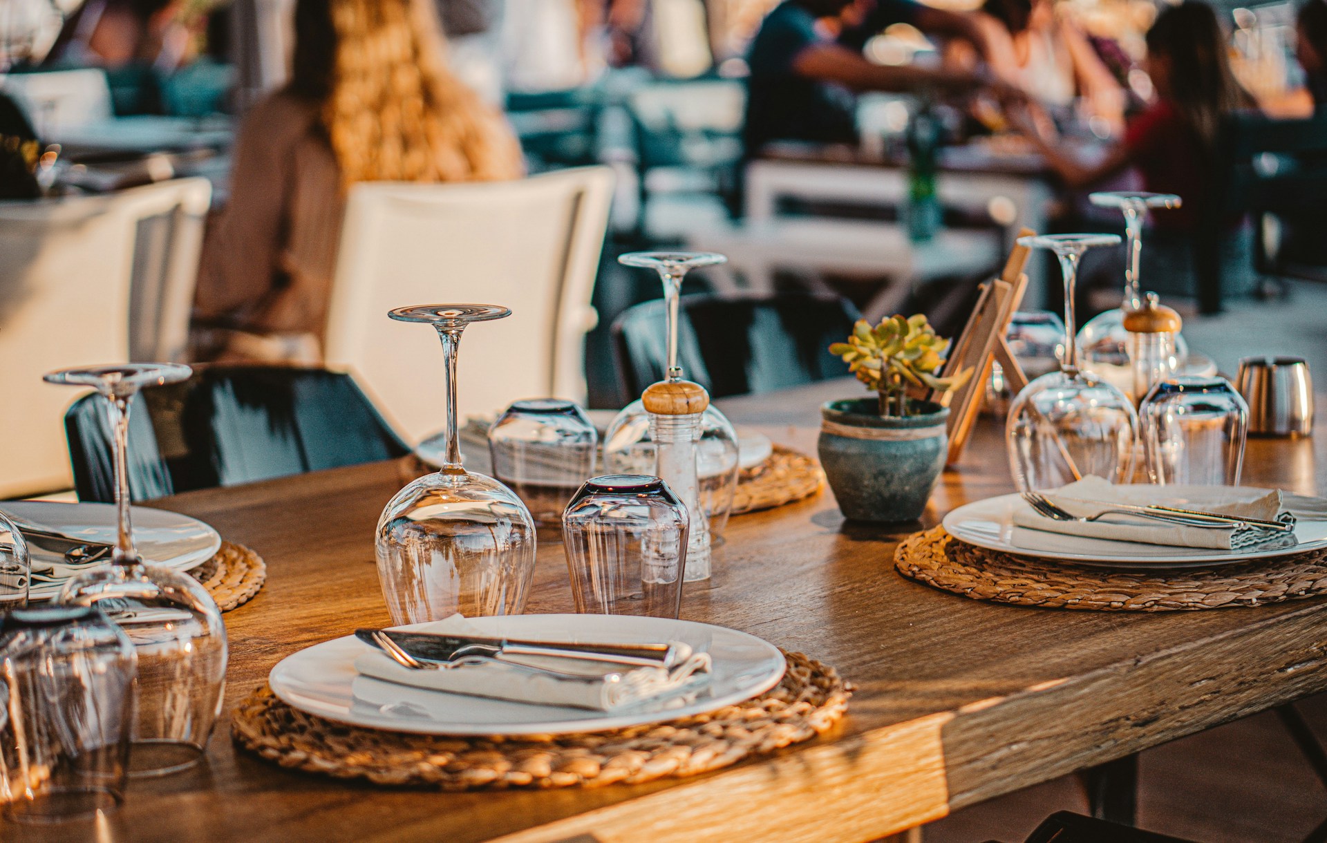 Nicely set table outdoors in evening sunshine