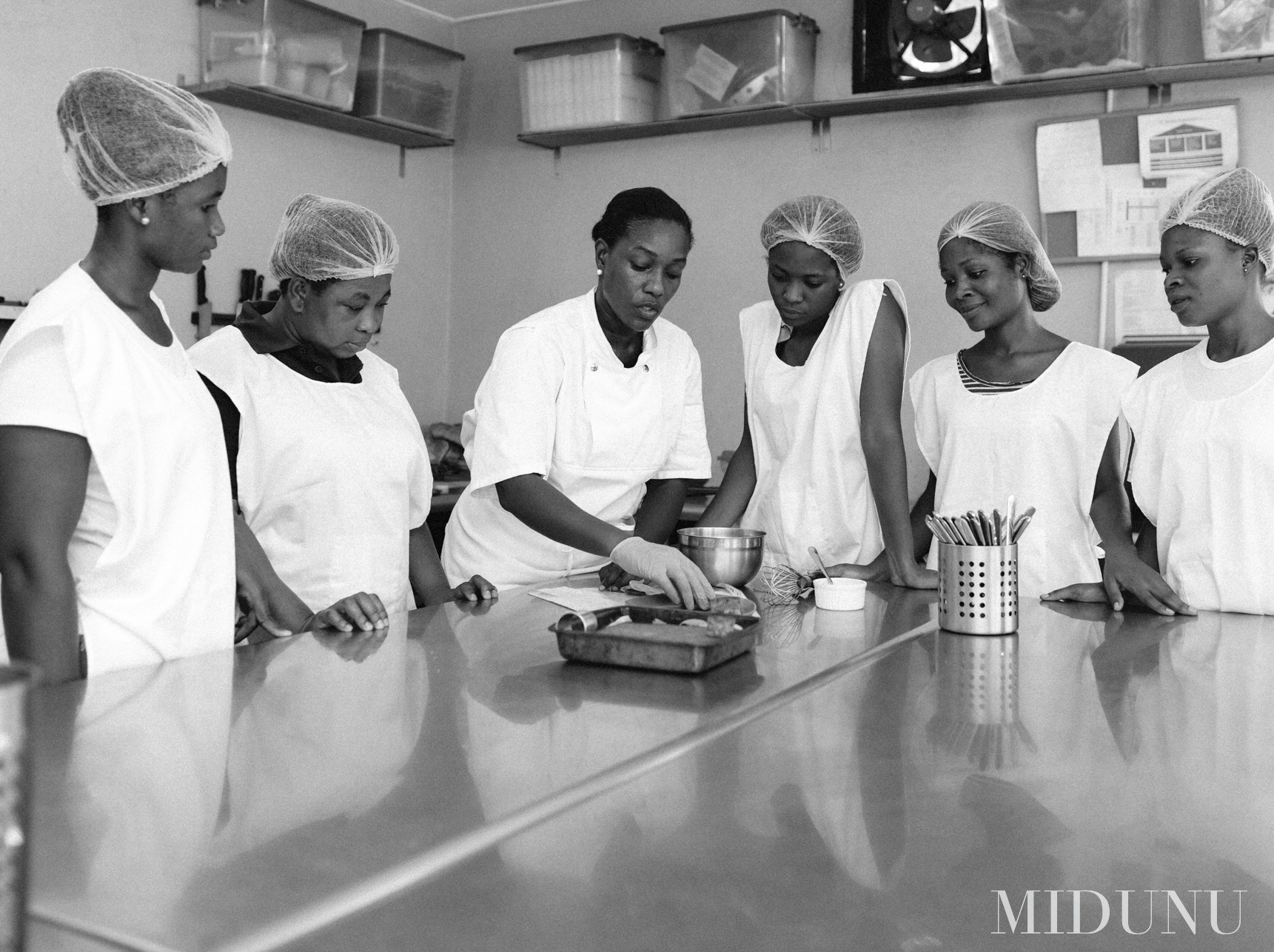 Black and white photo of the team at Midunu