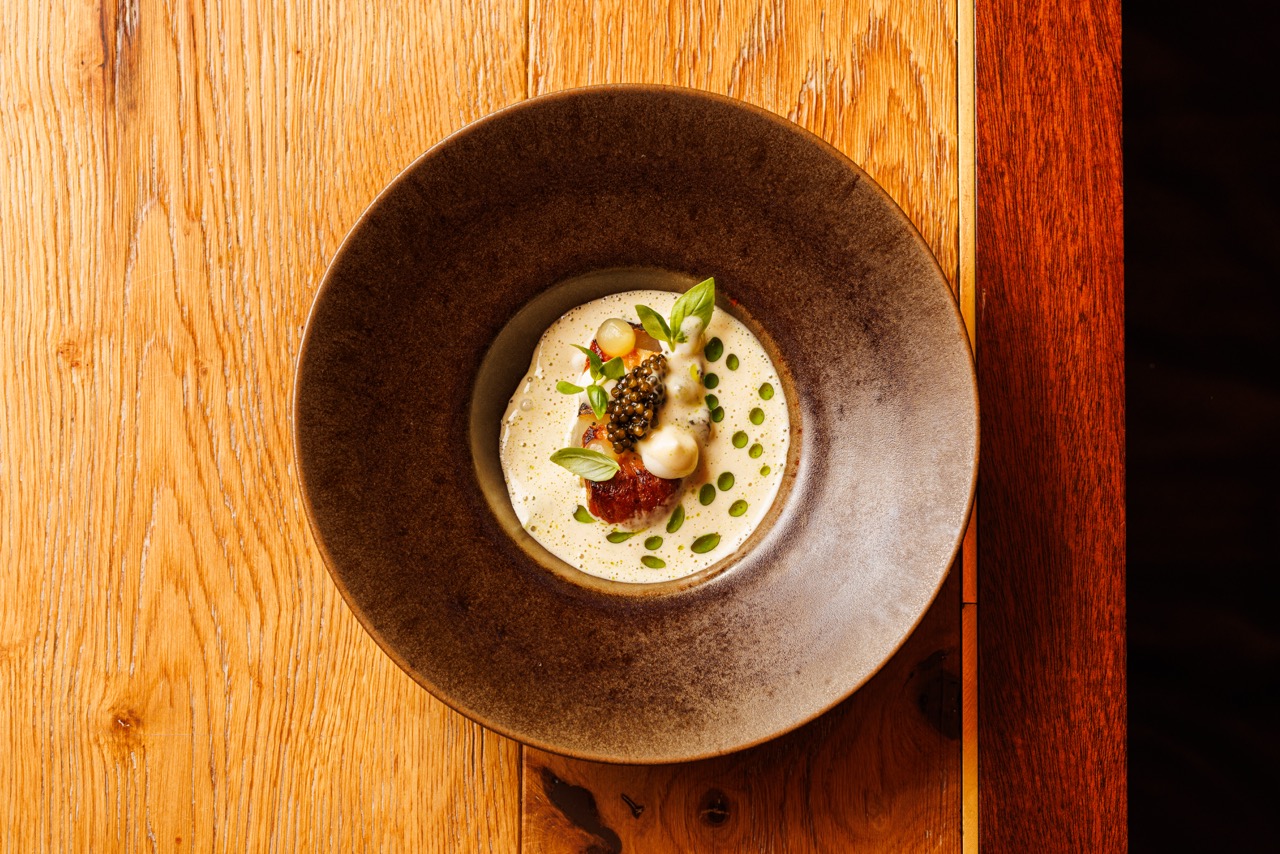 Overhead shot of the Ajwaini Orkney Scallop dish at Bibi, photographed by Anton Rodriguez