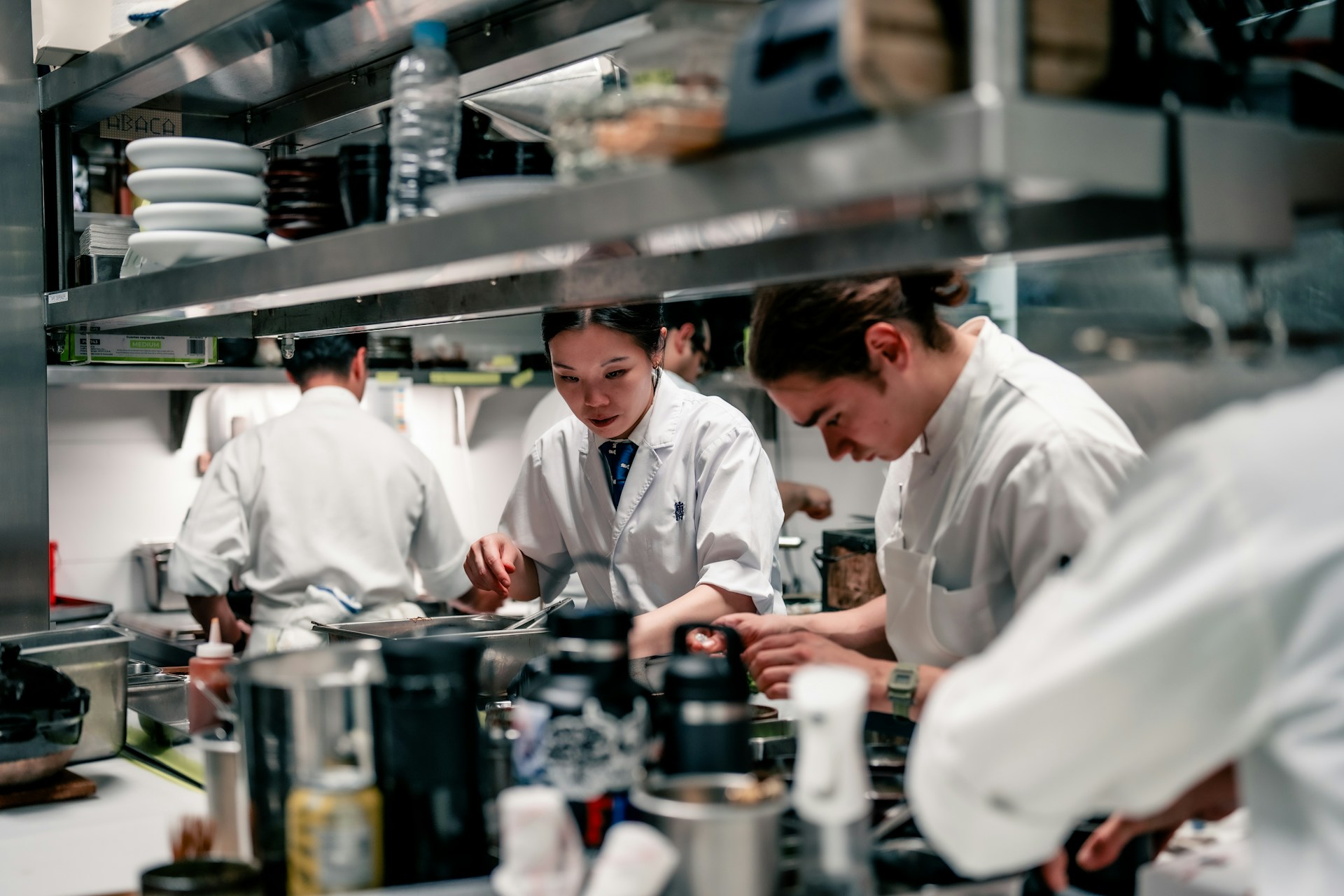 Chefs in kitchen working hard and concentrating