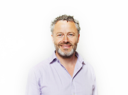 A headshot of Simon Heppner against a white background